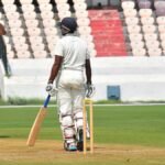 Who is Rohit Sharma, the bowler who took four wickets for Jammu and Kashmir against Madhya Pradesh?